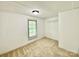 Cozy bedroom featuring neutral carpet, a large window, and ample natural light at 325 Scaley Bark Dr, Salisbury, NC 28147