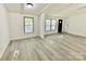 Comfortable living room featuring light grey flooring, bright lighting and large windows at 325 Scaley Bark Dr, Salisbury, NC 28147