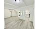 Bright and open living room with modern flooring and a partial view of the updated kitchen at 325 Scaley Bark Dr, Salisbury, NC 28147