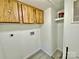 Utility room with overhead cabinets and closet space, ready for laundry appliances at 325 Scaley Bark Dr, Salisbury, NC 28147