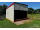 Exterior view of barn with open bay and adjacent fenced pasture at 3375 Shepherd Rd, Maiden, NC 28650