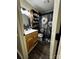 Bathroom with sleek sink and vanity, complemented by a floral shower curtain at 3375 Shepherd Rd, Maiden, NC 28650