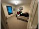 Bedroom with carpeted floor, neutral walls, and window with blue curtains at 3375 Shepherd Rd, Maiden, NC 28650