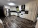 Well-lit kitchen boasts stainless steel appliances and sleek countertops at 3375 Shepherd Rd, Maiden, NC 28650
