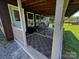 Covered porch with patterned rugs and rocking chairs at 3375 Shepherd Rd, Maiden, NC 28650