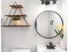 Modern bathroom with stylish fixtures, a round mirror, and decorative shelving for a clean, updated look at 402 Ford St, Kannapolis, NC 28083