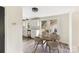 Cozy dining area featuring a modern table set near bright windows and adjacent to the updated kitchen at 402 Ford St, Kannapolis, NC 28083