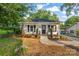 Charming single-story home with white siding, front porch, and landscaped front yard at 402 Ford St, Kannapolis, NC 28083