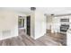 Open-concept view of kitchen with white cabinets and stainless steel appliances at 402 Ford St, Kannapolis, NC 28083