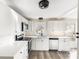 Modern kitchen with white cabinets, stainless steel appliances, and stylish backsplash at 402 Ford St, Kannapolis, NC 28083
