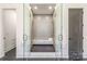 A modern glass enclosed shower is centered between two doorways in this modern bath at 412 Jefferson Dr, Charlotte, NC 28270