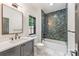 Modern bathroom featuring a shower, a blue vanity and carrara flooring at 412 Jefferson Dr, Charlotte, NC 28270