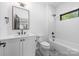 Modern bathroom with white subway tile, sleek black fixtures, and contemporary vanity with great finishes at 412 Jefferson Dr, Charlotte, NC 28270