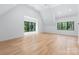 Bright, spacious bedroom with hardwood floors, high ceilings, and large windows providing ample natural light at 412 Jefferson Dr, Charlotte, NC 28270