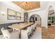 Dining room boasts wood ceiling, modern chandelier, and view to kitchen at 412 Jefferson Dr, Charlotte, NC 28270