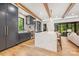 Modern kitchen features a marble island, hardwood floors, and dark cabinets at 412 Jefferson Dr, Charlotte, NC 28270