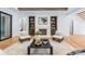Inviting living room with a stone fireplace, built-in shelves, and a view into the dining and kitchen areas at 412 Jefferson Dr, Charlotte, NC 28270