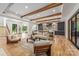 Spacious open-concept living area with wood beams, hardwood floors, and seamless flow to the kitchen at 412 Jefferson Dr, Charlotte, NC 28270