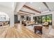 Expansive living space with hardwood floors, natural light, and direct access to both the kitchen and dining area at 412 Jefferson Dr, Charlotte, NC 28270