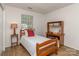 Comfortable bedroom includes a twin bed and a wooden desk with shelving at 4801 Pennant Pl, Charlotte, NC 28212