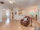 Spacious living room flows to kitchen and dining room, with ceiling fan at 4801 Pennant Pl, Charlotte, NC 28212