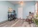 Versatile office area with desk, chair, and a charming rocking chair at 4801 Pennant Pl, Charlotte, NC 28212