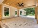 Expansive outdoor patio with tongue and groove ceiling, rustic wood supports, and fan providing a relaxing space at 501 E Cj Thomas Rd # 1, Monroe, NC 28110
