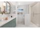 Well-lit bathroom features a glass shower, spacious vanity, and modern fixtures at 5611 Robinhood Rd, Charlotte, NC 28211