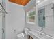 Bright bathroom with a modern vanity, walk-in shower, and window at 5611 Robinhood Rd, Charlotte, NC 28211