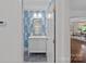 Stylish bathroom featuring a vanity and patterned wallpaper at 5611 Robinhood Rd, Charlotte, NC 28211