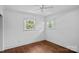 Bedroom with hardwood floors and natural light from two windows at 5611 Robinhood Rd, Charlotte, NC 28211
