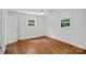 Bright bedroom with hardwood floors and abundant natural light from two windows at 5611 Robinhood Rd, Charlotte, NC 28211