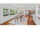 Charming dining room with a large window, hardwood floors, and comfortable seating at 5611 Robinhood Rd, Charlotte, NC 28211