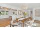 Open dining area with hardwood floors and a decorative chandelier at 5611 Robinhood Rd, Charlotte, NC 28211