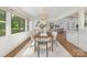 Bright dining room with hardwood floors and large window, perfect for entertaining at 5611 Robinhood Rd, Charlotte, NC 28211