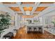 Spacious kitchen featuring marble countertops, hardwood floors, and seamless flow into the dining area at 5611 Robinhood Rd, Charlotte, NC 28211