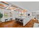 Open-concept kitchen featuring hardwood floors, marble countertops, and modern appliances at 5611 Robinhood Rd, Charlotte, NC 28211