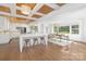 Open concept kitchen with a center island and ample seating and hardwood floors at 5611 Robinhood Rd, Charlotte, NC 28211