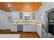 Bright kitchen with stainless steel appliances, marble countertops, and custom white cabinetry at 5611 Robinhood Rd, Charlotte, NC 28211