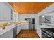 Well-appointed kitchen with stainless steel appliances, marble countertops, and custom cabinetry at 5611 Robinhood Rd, Charlotte, NC 28211