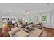 Spacious living room with hardwood floors and ample natural light perfect for entertaining at 5611 Robinhood Rd, Charlotte, NC 28211