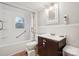 Cozy bathroom with a tub/shower combination, vanity sink, and ample natural light at 626 Cabarrus W Ave, Concord, NC 28027
