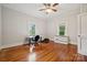 Spacious bedroom offers hardwood floors, neutral paint, and abundant natural light from two windows at 626 Cabarrus W Ave, Concord, NC 28027