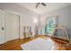 Inviting bedroom featuring hardwood floors, area rug, and natural light from the window at 626 Cabarrus W Ave, Concord, NC 28027