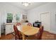 Bright kitchen with a dining table set, featuring natural light and essential appliances at 626 Cabarrus W Ave, Concord, NC 28027