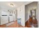 Functional laundry room with modern appliances and convenient access to other rooms at 626 Cabarrus W Ave, Concord, NC 28027