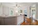 Inviting living room boasts gleaming hardwood floors, a sectional sofa and bright natural light at 626 Cabarrus W Ave, Concord, NC 28027