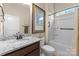 Well-lit bathroom featuring granite countertops, white tub and shower combination, and neutral colored walls at 6506 Jepson Ct # 349, Charlotte, NC 28214