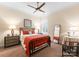 Cozy bedroom with a ceiling fan, shuttered window, and neutral decor at 6506 Jepson Ct # 349, Charlotte, NC 28214
