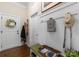 Cozy entryway featuring white wainscoting, coat hooks, bench seating with storage, and decor accents at 6506 Jepson Ct # 349, Charlotte, NC 28214